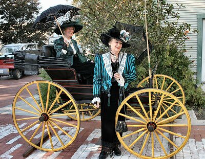 Victorian Tea Society ladies with old-fashioned carriage